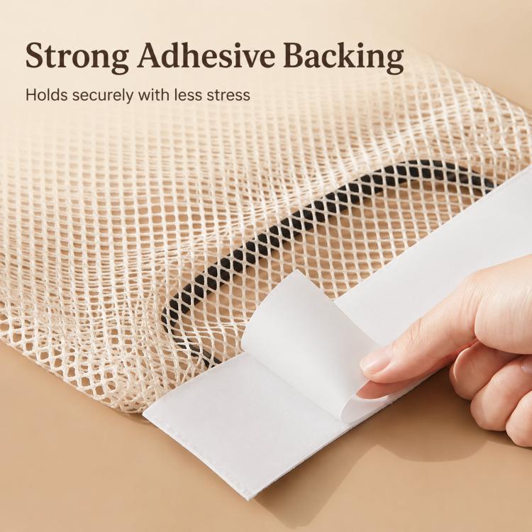 Adhesive backing strip attaching to beige mesh bag holder with elastic net panel.