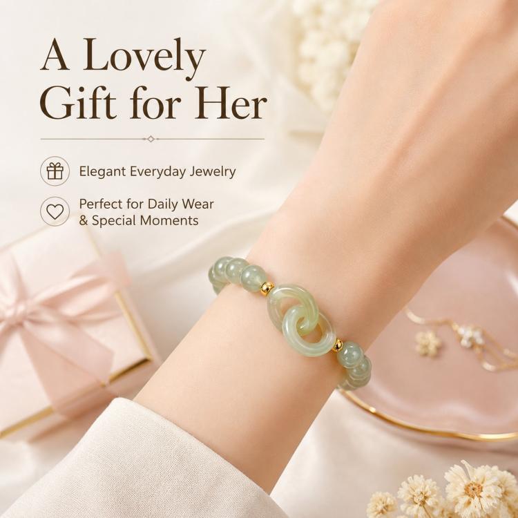 Green jade-style beaded bracelet on wrist with interlocking double loop and gold accents