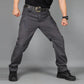 Gray hiking pants with belt loops and zip fly; cargo pocket details on thighs
