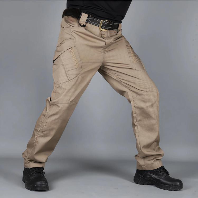 Khaki outdoor hiking pants with belt loops and zip fly; cargo pockets at thighs