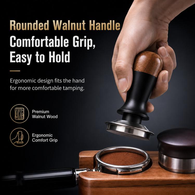 Coffee tamper held in hand with walnut wood handle, black body, and stainless tamp base