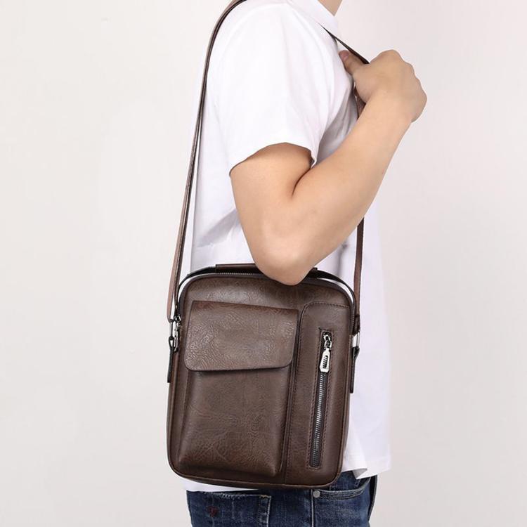 Men's vintage crossbody shoulder bag on a person, dark brown leather-look with flap pocket
