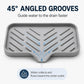 Gray slanted silicone sink tray with angled grooves guiding water to center outlet
