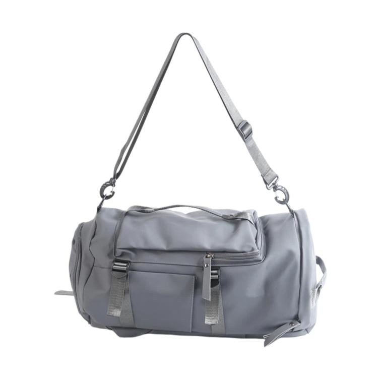 Gray duffel-style wet and dry separation travel bag with shoulder strap and front pocket