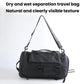 Black duffel-style travel bag with shoulder straps and front zip pocket