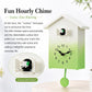 House-shaped wall clock with green gradient face, black hands, and open bird window detail