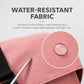 Water-resistant fabric close-up on pink duffel bag with textured weave