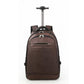 Brown rolling backpack with telescoping trolley handle and front zip pocket.