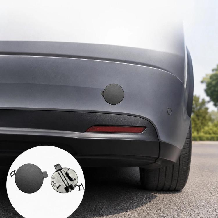 Gray textured rear bumper tow hook cover, mounted over the tow hook opening