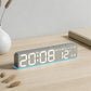 Fabric-style LED digital alarm clock with glowing time and temperature digits