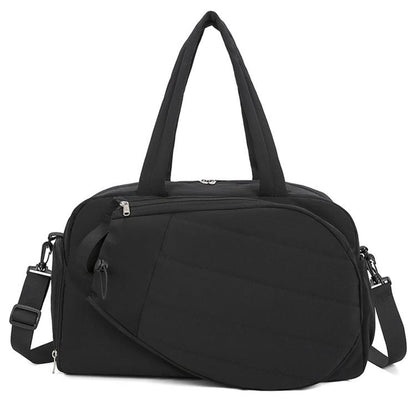 Black waterproof duffel bag with top handles and shoulder strap