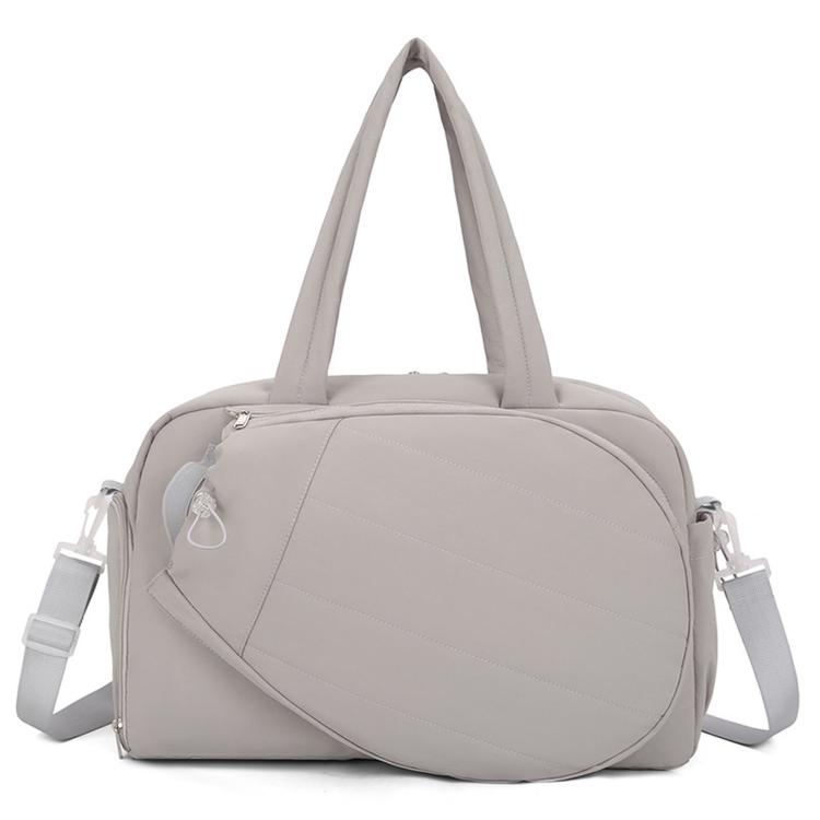 Grey waterproof duffel bag with top handles and side shoulder straps