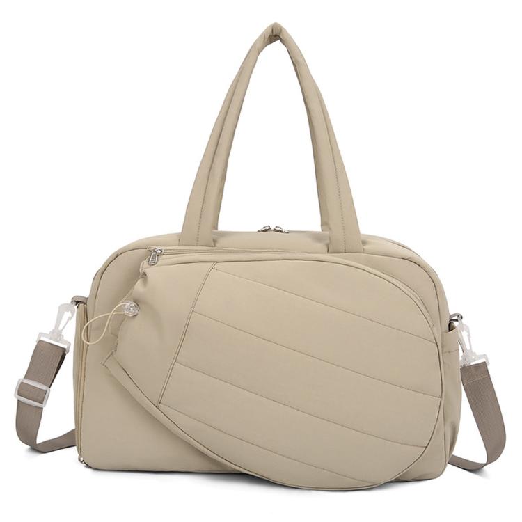 Light tan waterproof duffel bag with top handles and crossbody straps