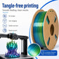 Rainbow PLA filament spool beside 3D printer extruder, smooth feeding setup