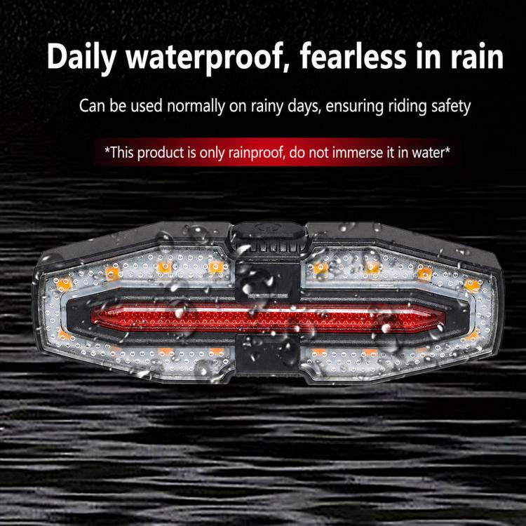Bicycle remote tail light, clear side LEDs around a red inner warning strip in black housing