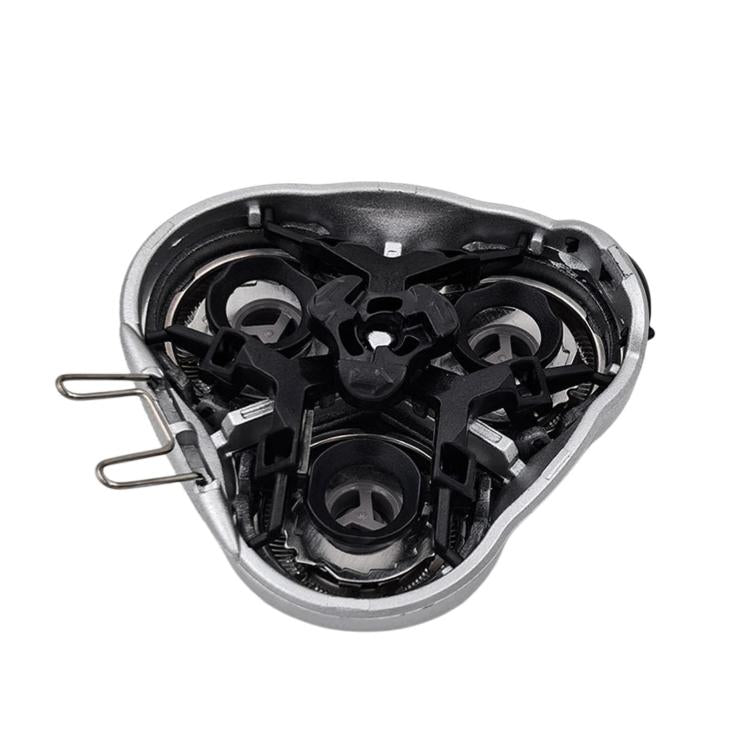 Shaver head replacement underside with black blade mechanisms inside silver housing