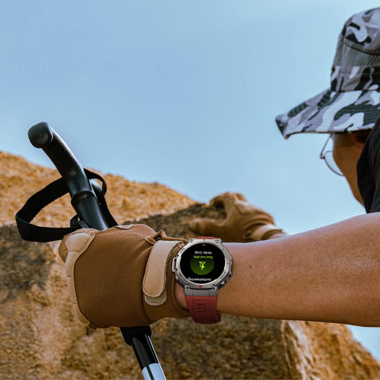 GPS sports smartwatch with a red band worn outdoors