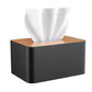 Black tissue box with wooden top and white tissues, front view