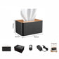 Black tissue box–style audio protection device with wooden lid, plus accessories