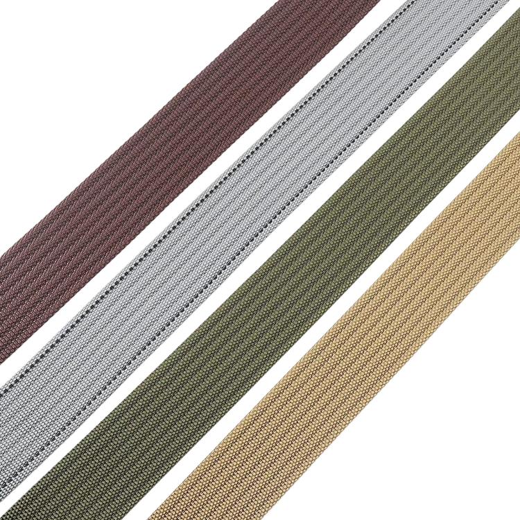 Woven nylon belt strap close-up with multicolor threads in brown, white, green, and tan