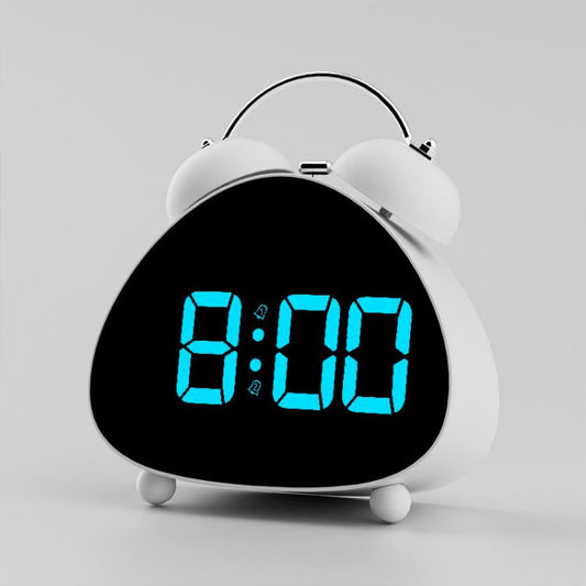 White twin-bell alarm clock with glowing blue digital time on black face.