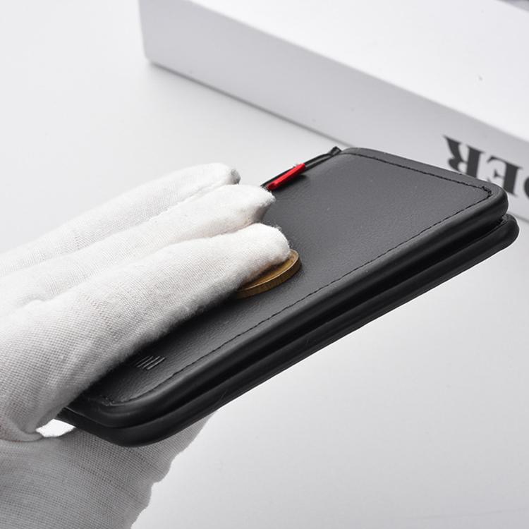Men's black vertical wallet held in a hand, showing smooth leather-like texture