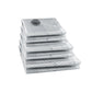 Folded clear vacuum compression bags with round valve cap, ready for clothing storage