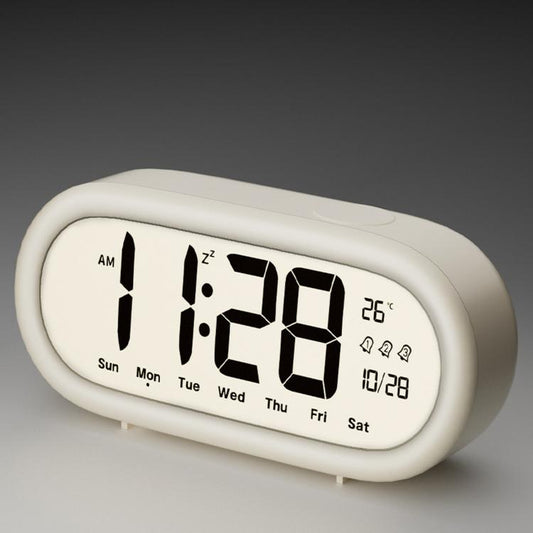 White digital alarm clock with large time, date, and temperature display icons