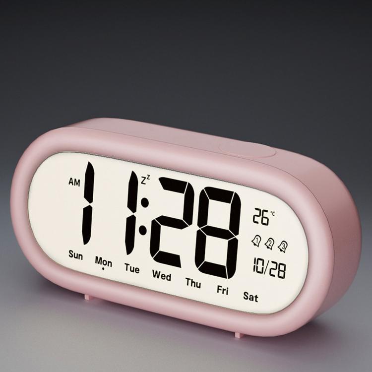 Pink digital alarm clock with large time, date, and temperature display icons