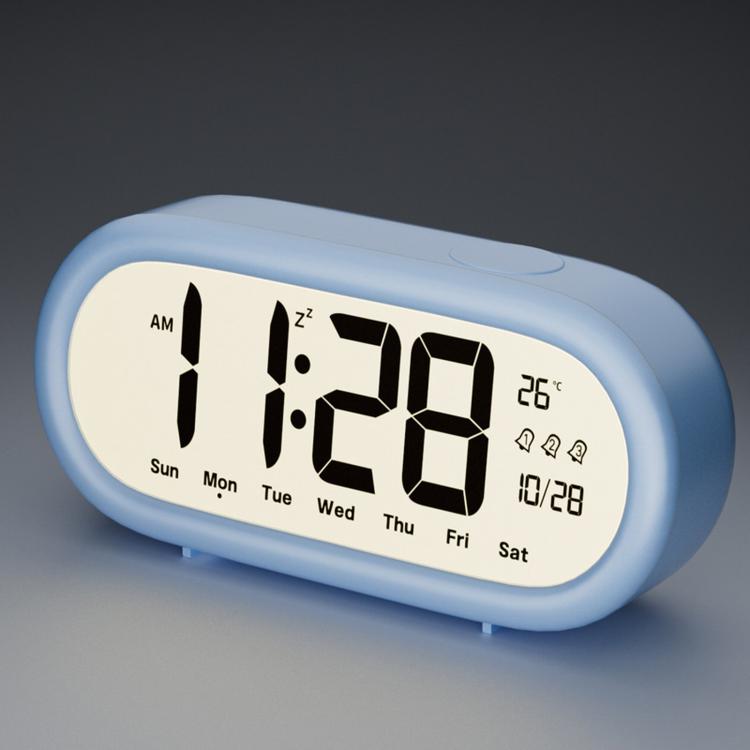 Light blue digital alarm clock with large time, date, and temperature display icons