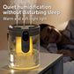 Black-tinted 1.5L humidifier releasing mist with warm ambient night light