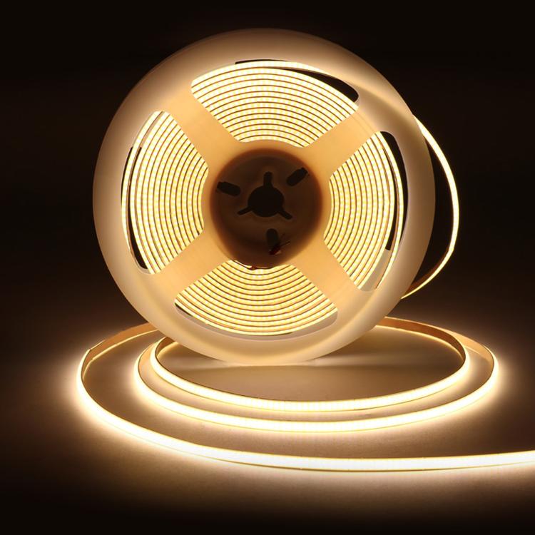 Warm white COB LED light strip, glowing circular coil on a base stand