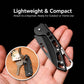 Black lightweight folding knife with carabiner, held in hand