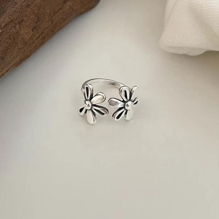 Sterling silver adjustable open ring with two daisy flower charms