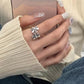 Sterling silver open daisy flower ring on hand, adjustable fit