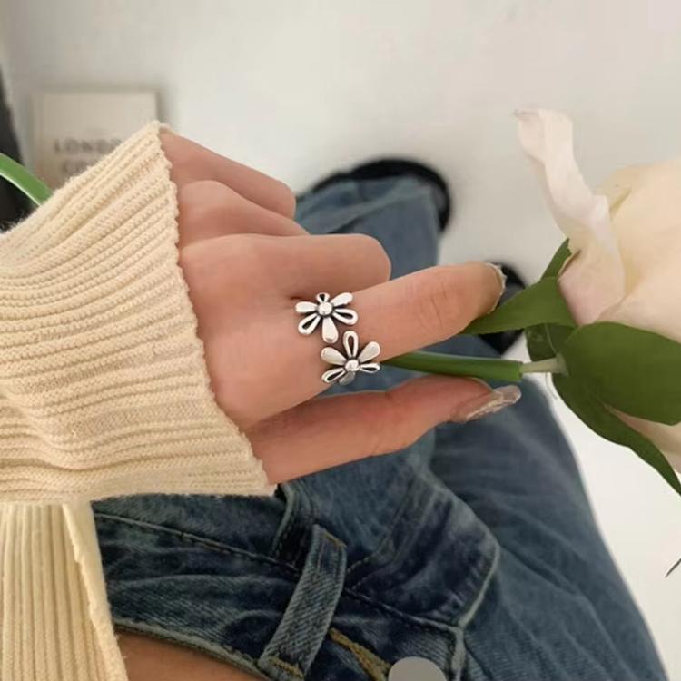 Sterling silver adjustable daisy open ring with three flower accents