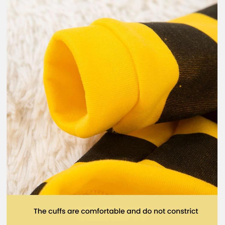 Close-up of yellow-and-black striped dog hoodie coat sleeve and hood cuff