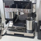 Black drip tray protective cover installed on coffee machine cup tray