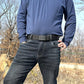 Elastic web belt in dark gray/black with square automatic buckle on jeans