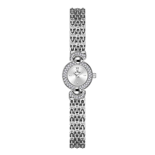 Silver rhinestone bracelet watch with small round dial and link chain band.
