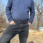 Dark gray elastic belt worn at the waist with sliding buckle visible
