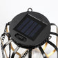 Solar panel top of black hanging lantern with blue solar cells