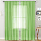 Single sheer rod-pocket voile window curtain, green, with lightly striped panel look.