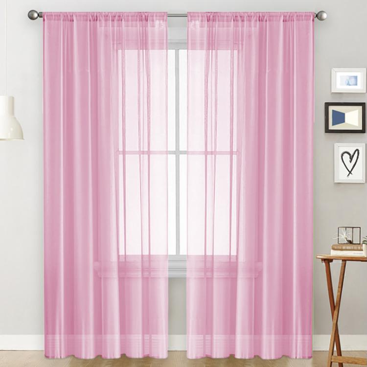 Single sheer light-filtering window curtain in pink with rod pocket header and grid panels