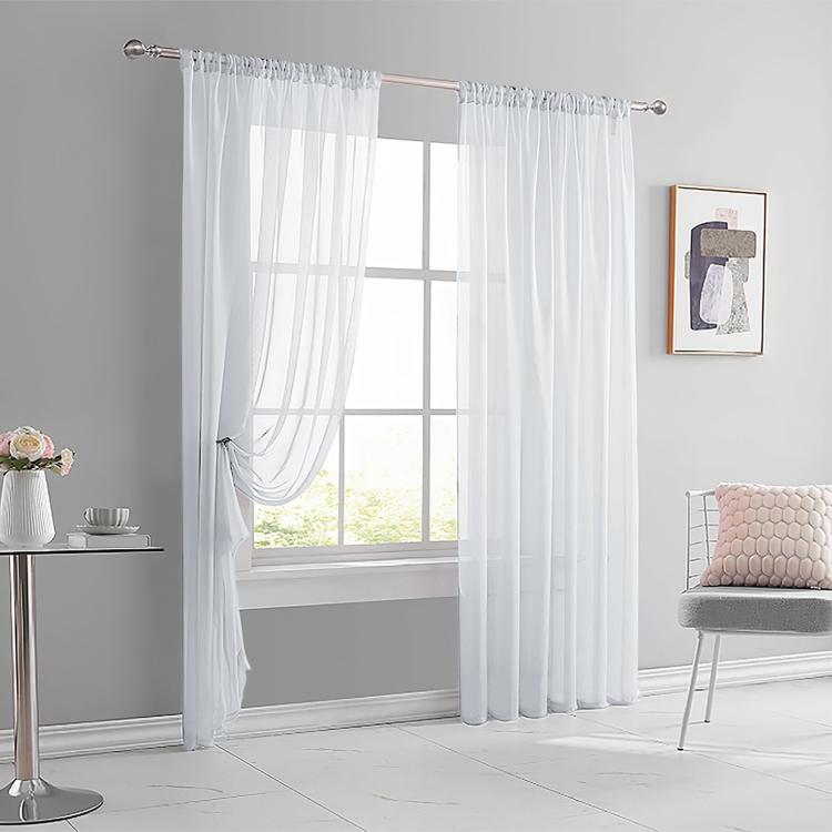 White sheer rod pocket window curtain panel with gathered top and flowing bottom