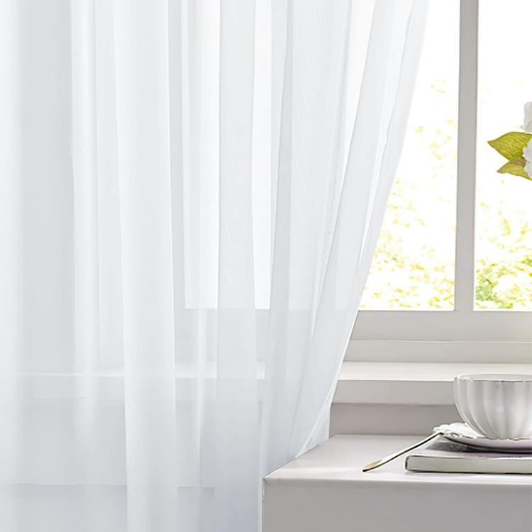White sheer curtain fabric panel with vertical folds and translucent light