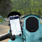 Motorcycle phone holder with wireless charging pad, holds a phone on a clamp