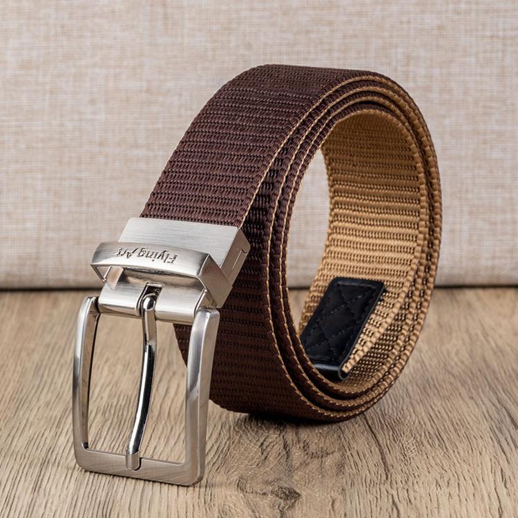 Brown belt detail: silver rotating pin buckle on woven strap