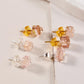 Resin stud earrings with clear and pink-toned pieces and small metal posts