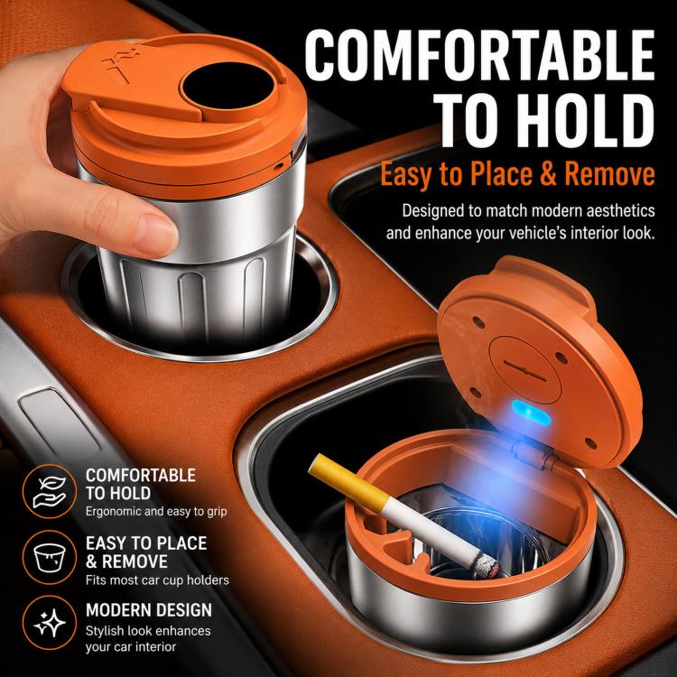 Orange metal car ashtray with LED-lit lid, shown in a hand on a dashboard
